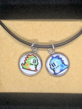 Load image into Gallery viewer, Nintendo Inspired Bubble Bobble 8-bit retro Necklace On Waxed Black Adjustable Cord Blue and Green Character Charms