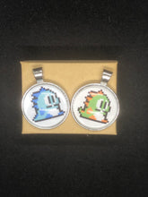 Load image into Gallery viewer, Nintendo Inspired Bubble Bobble 8-bit retro Necklace On Waxed Black Adjustable Cord Blue or Green Character Charms
