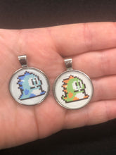 Load image into Gallery viewer, Nintendo Inspired Bubble Bobble 8-bit retro Necklace On Waxed Black Adjustable Cord Blue or Green Character Charms
